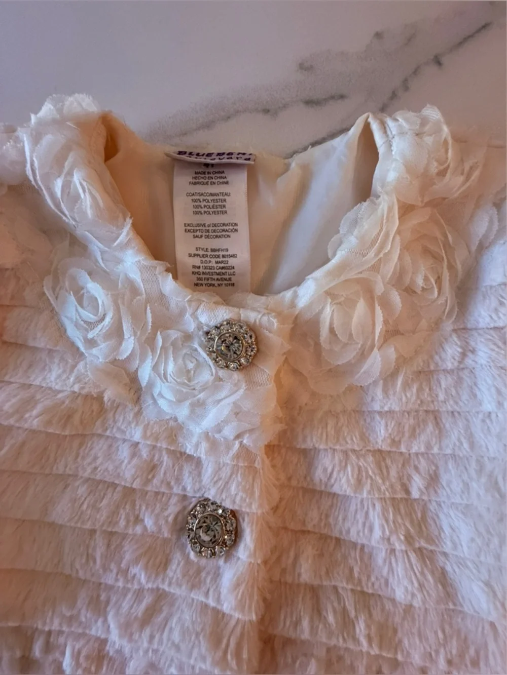 Blueberi Boulevard girl's ivory textured faux-fur coat.